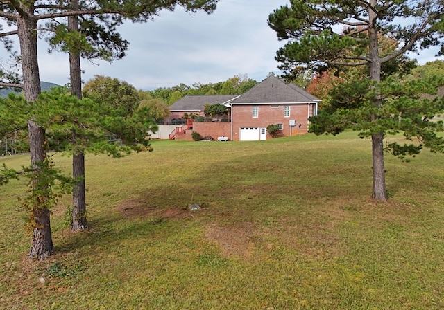 view of yard with a garage