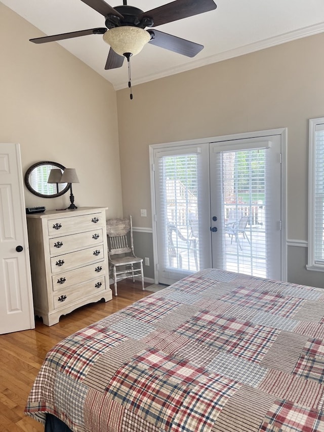 bedroom featuring a ceiling fan, wood finished floors, ornamental molding, french doors, and access to outside