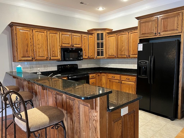 1647-8H Lakeview Dr, Young Harris, GA 30582 - kitchen featuring a peninsula, glass insert cabinets, dark stone counters, brown cabinets, and black appliances