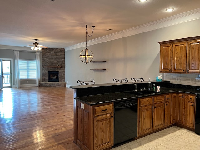 1647-8H Lakeview Dr, Young Harris, GA 30582 - kitchen with ceiling fan, a sink, black appliances, a peninsula, and ornamental molding