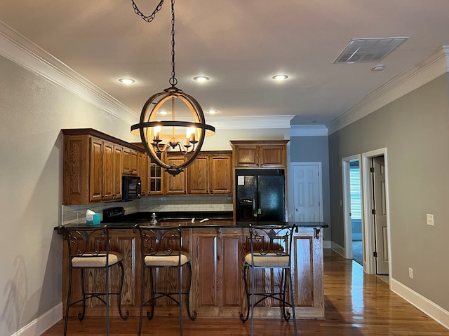 1647-8H Lakeview Dr, Young Harris, GA 30582 - kitchen featuring visible vents, dark countertops, a chandelier, backsplash, and black appliances