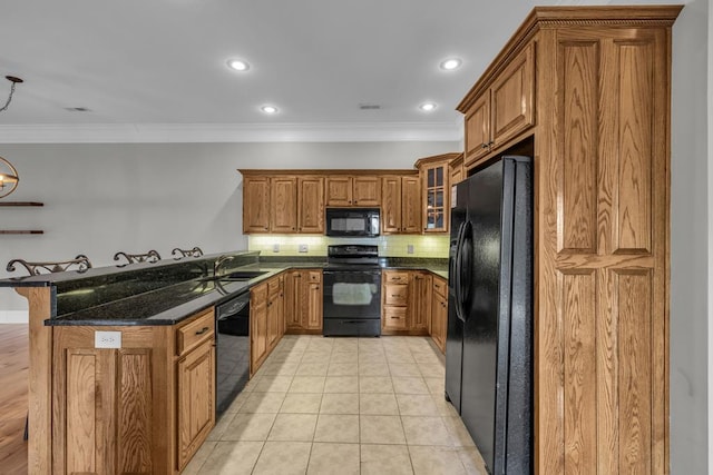 1647-8H Lakeview Dr, Young Harris, GA 30582 - kitchen with brown cabinetry, a sink, black appliances, a peninsula, and ornamental molding