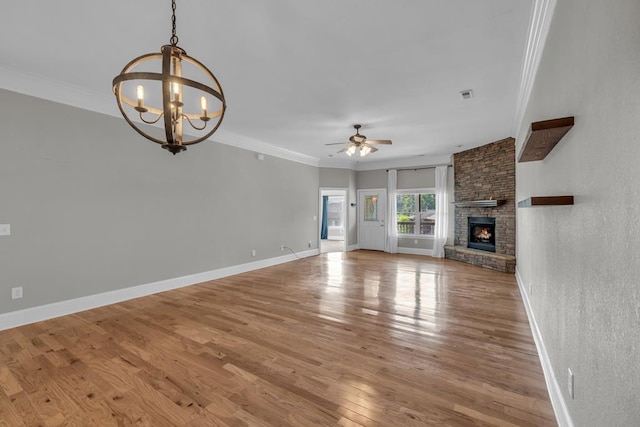 1647-8H Lakeview Dr, Young Harris, GA 30582 - unfurnished living room featuring crown molding, a large fireplace, wood finished floors, and ceiling fan with notable chandelier