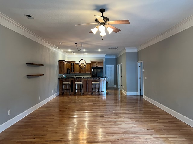1647-8H Lakeview Dr, Young Harris, GA 30582 - unfurnished living room with ceiling fan, ornamental molding, wood finished floors, and visible vents