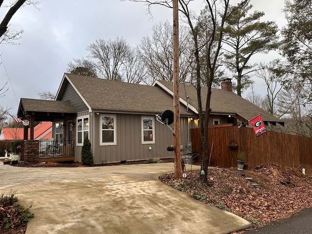 610 E Second St, Blue Ridge, GA 30513 - view of front of property with a shingled roof, board and batten siding, driveway, and a chimney