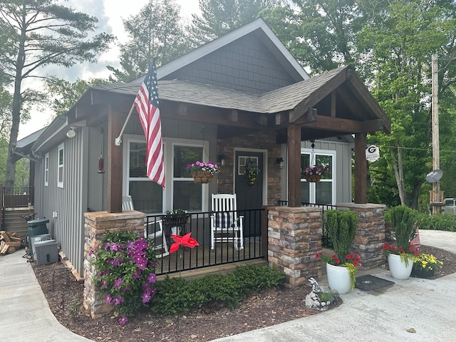 610 E Second St, Blue Ridge, GA 30513 - craftsman house featuring covered porch, roof with shingles, stone siding, and board and batten siding