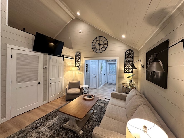 610 E Second St, Blue Ridge, GA 30513 - living area with light wood finished floors, wooden walls, a barn door, and recessed lighting