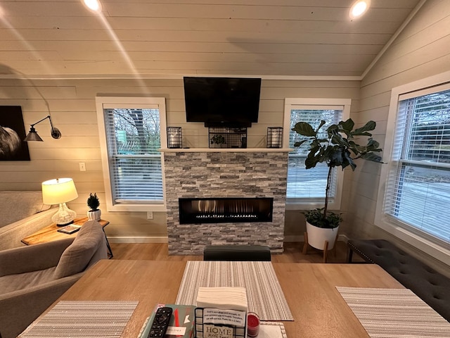 610 E Second St, Blue Ridge, GA 30513 - living room featuring vaulted ceiling, a fireplace, wood finished floors, and wooden walls