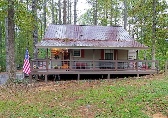 back of house with metal roof