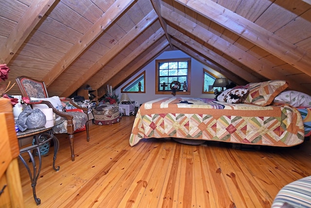 bedroom with wood-type flooring, lofted ceiling with beams, and wood ceiling