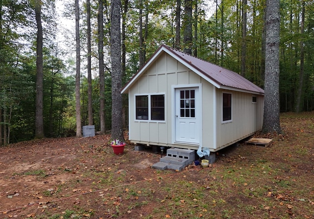 view of outbuilding with entry steps and an outdoor structure
