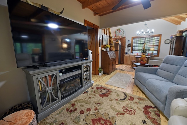living room featuring wooden ceiling, light wood-type flooring, ceiling fan with notable chandelier, and vaulted ceiling with beams