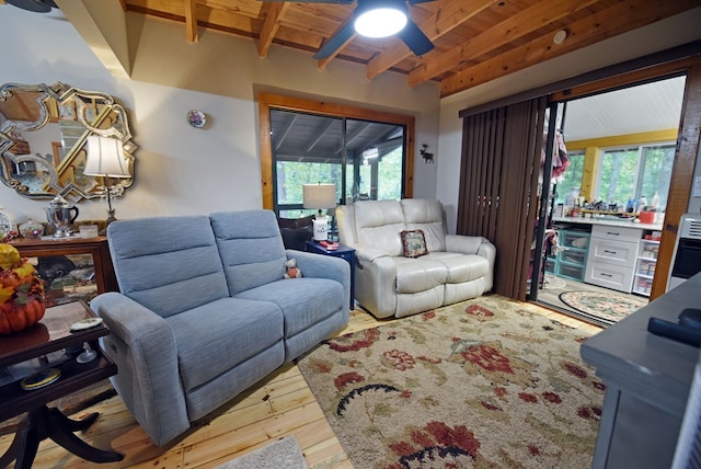 living room with wood ceiling, beam ceiling, a ceiling fan, and hardwood / wood-style floors