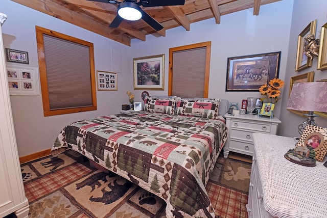 bedroom with wooden ceiling, ceiling fan, and beam ceiling