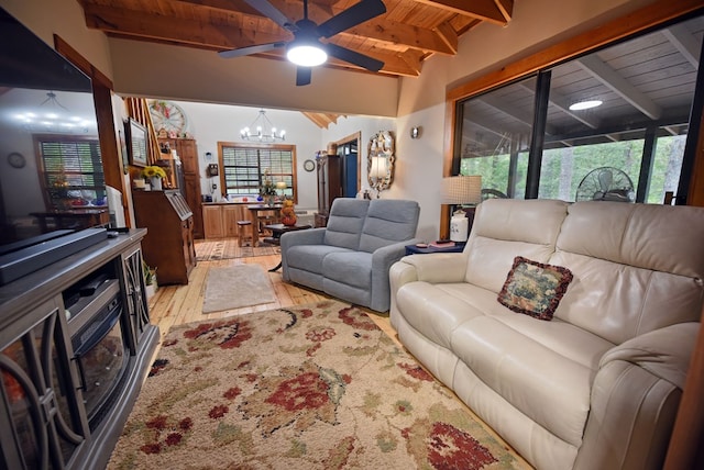 living room featuring light wood-type flooring, beam ceiling, wooden ceiling, and ceiling fan with notable chandelier