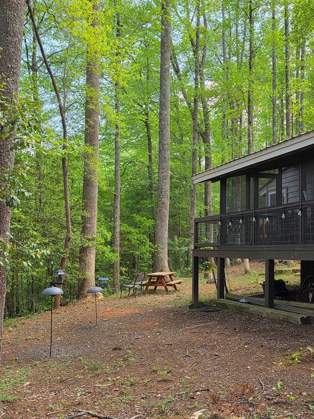 view of yard featuring a sunroom