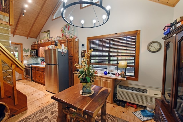 dining area with light wood-type flooring, high vaulted ceiling, wooden ceiling, an inviting chandelier, and an AC wall unit