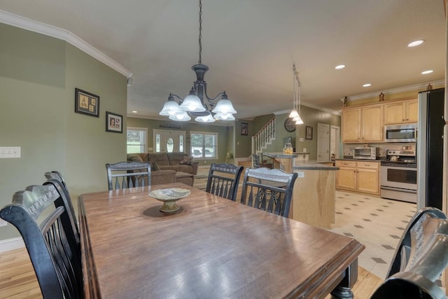 dining space featuring a notable chandelier and crown molding