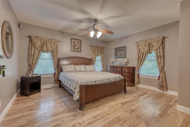 bedroom featuring ceiling fan and light hardwood / wood-style flooring