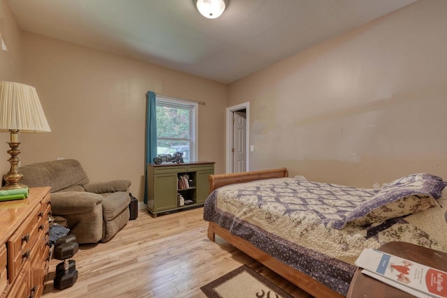 bedroom with light hardwood / wood-style floors