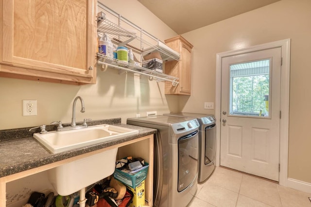 laundry area with cabinets, sink, light tile patterned floors, and independent washer and dryer