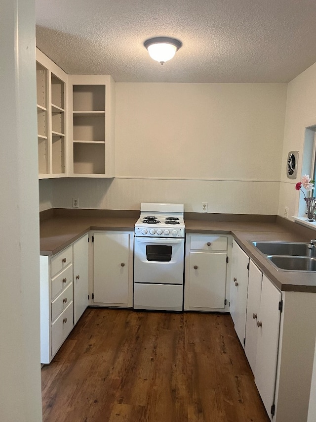 kitchen with white cabinetry, dark hardwood / wood-style floors, and white stove