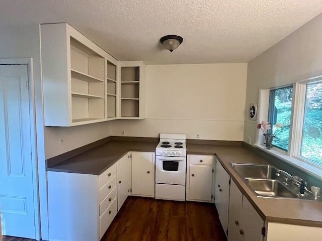 kitchen featuring white cabinetry, white range oven, dark wood-type flooring, and sink