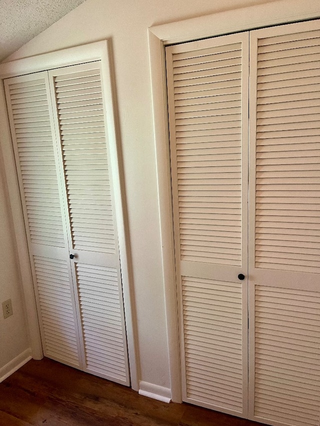 interior details featuring a textured ceiling and hardwood / wood-style flooring