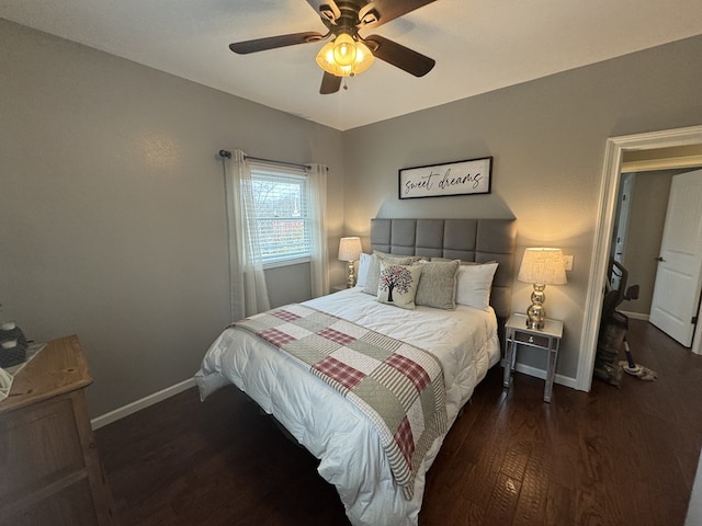 bedroom with ceiling fan and dark hardwood / wood-style floors