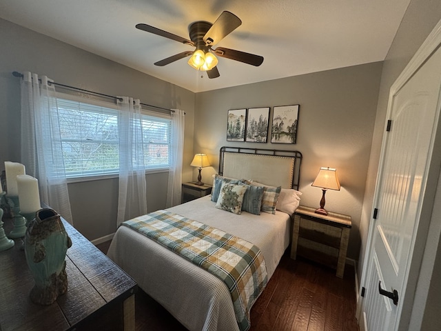 bedroom featuring dark hardwood / wood-style floors and ceiling fan