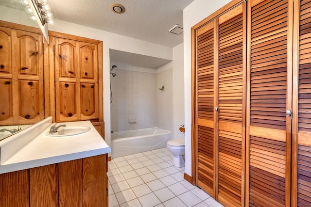full bath with a closet, tile patterned flooring, a textured ceiling, and toilet
