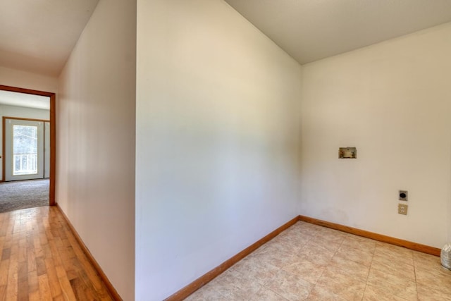 interior space featuring laundry area, hookup for a washing machine, hookup for an electric dryer, and baseboards