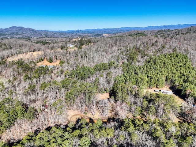 aerial view with a mountain view and a view of trees