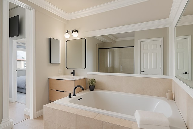 bathroom featuring crown molding, a garden tub, a stall shower, tile patterned floors, and vanity