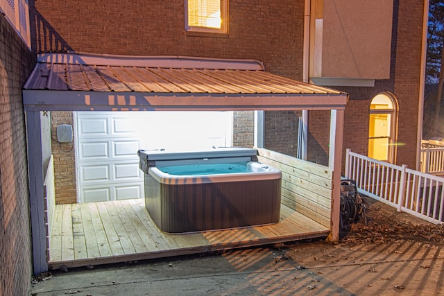 wooden deck featuring a hot tub