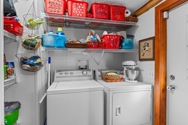 laundry area featuring laundry area and washer and clothes dryer