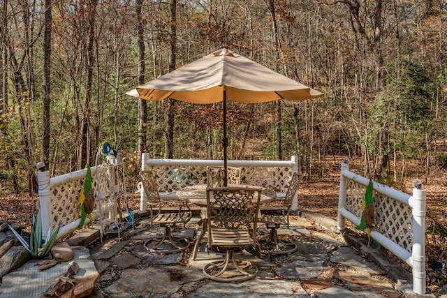 view of patio / terrace featuring a forest view