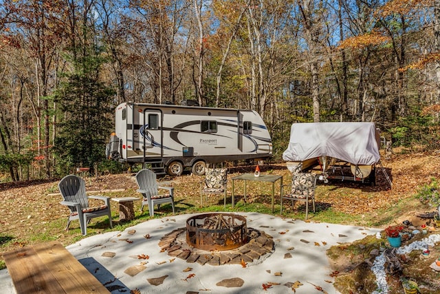 view of patio / terrace with a fire pit