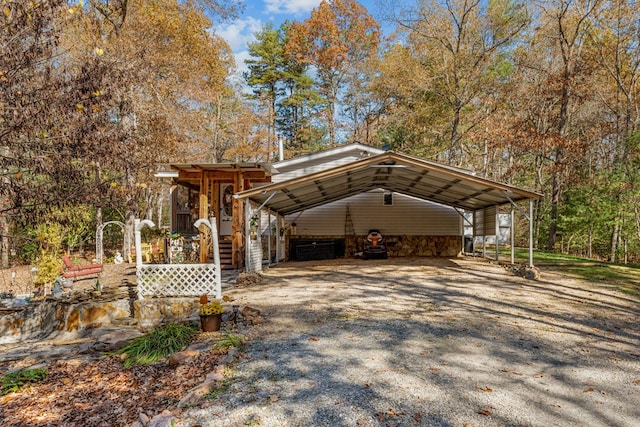 view of car parking featuring gravel driveway