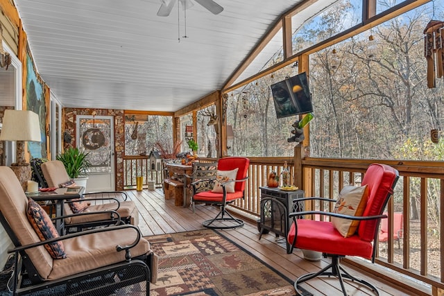 sunroom featuring a ceiling fan