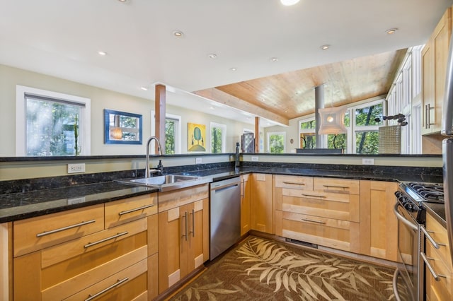 kitchen featuring stainless steel appliances, a healthy amount of sunlight, sink, wooden ceiling, and dark stone countertops