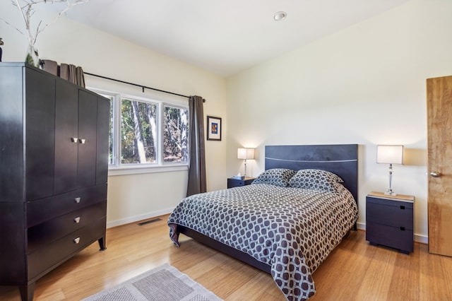 bedroom featuring light hardwood / wood-style floors