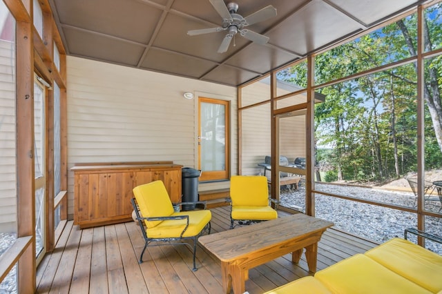 sunroom with ceiling fan and a healthy amount of sunlight