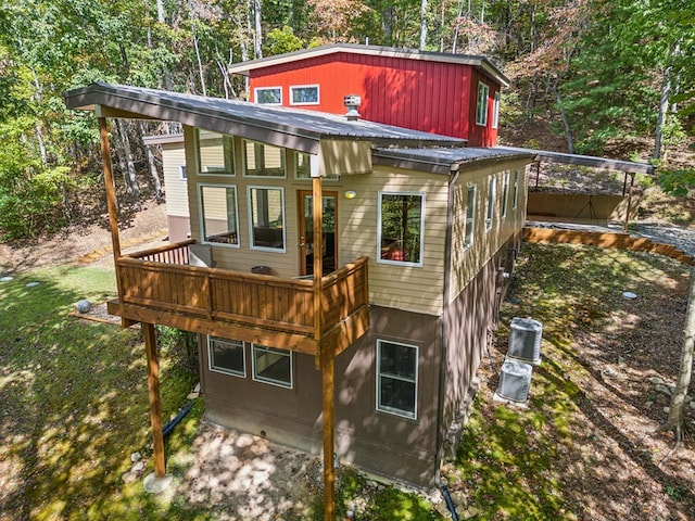 back of house with a wooden deck