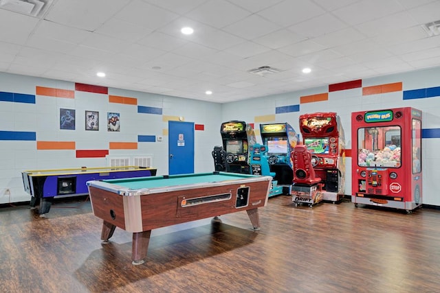 game room with billiards, visible vents, tile walls, and dark wood-type flooring