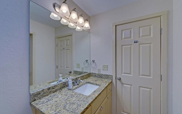 469 Hidden Valley Dr, Morganton, GA 30560 - bathroom featuring vanity, a textured wall, and a chandelier