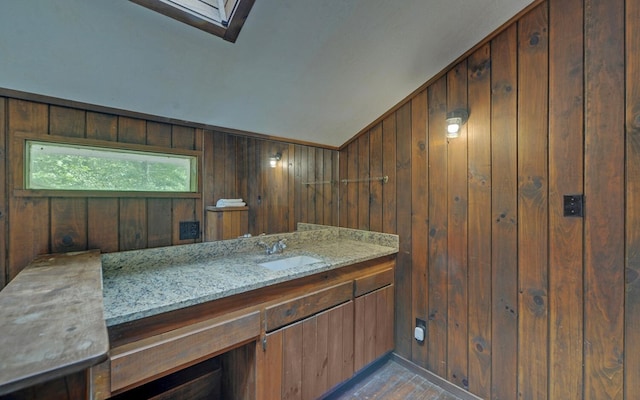 469 Hidden Valley Dr, Morganton, GA 30560 - bathroom with wooden walls, vanity, and wood finished floors