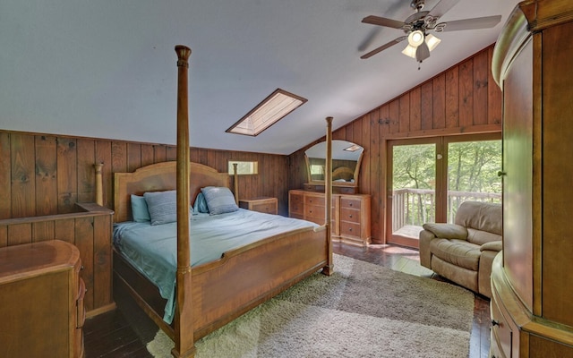 469 Hidden Valley Dr, Morganton, GA 30560 - bedroom featuring lofted ceiling, wood walls, access to exterior, wood finished floors, and a skylight