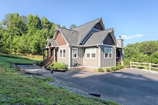 view of property exterior with a yard