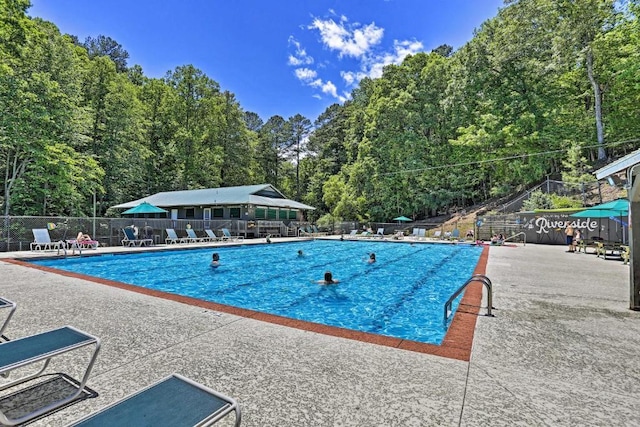 193 Alm Ln, Ellijay, GA 30540 - community pool with a patio and a forest view
